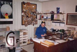 Gordon Giffon sitting at his desk at Giffin Interior in 1980