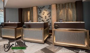 Hotel Front Desk featuring millwork from Giffin Interior