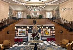 millwork on the walls of a large grandiose staircase at a hotel